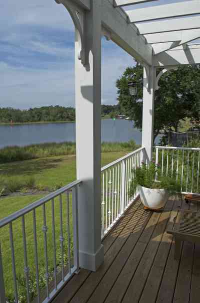 400+LaRua+Landing-2nd+floor++porch+facing+bayou+texar_6.jpg.jpg:  trellis, porch, railing, Bayou Texar, oak tree, 