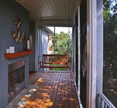 400+LaRua+Landing-2nd+floor+side+porch_01.jpg:  fireplace, porch swing, Coastal home, Pensacola, 