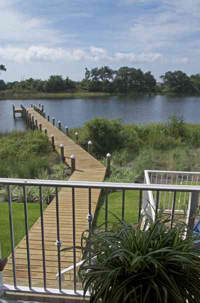 400+LaRua+Landing-3rd+floor+porch+facing+Bayou+Texar_01.jpg:  metal railing, porch island, Bayou Texar, dock, pier, , 
