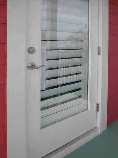 Aragon:-649-Aragon-Street_31.jpg:  back door, balcony, venitan blinds, porch