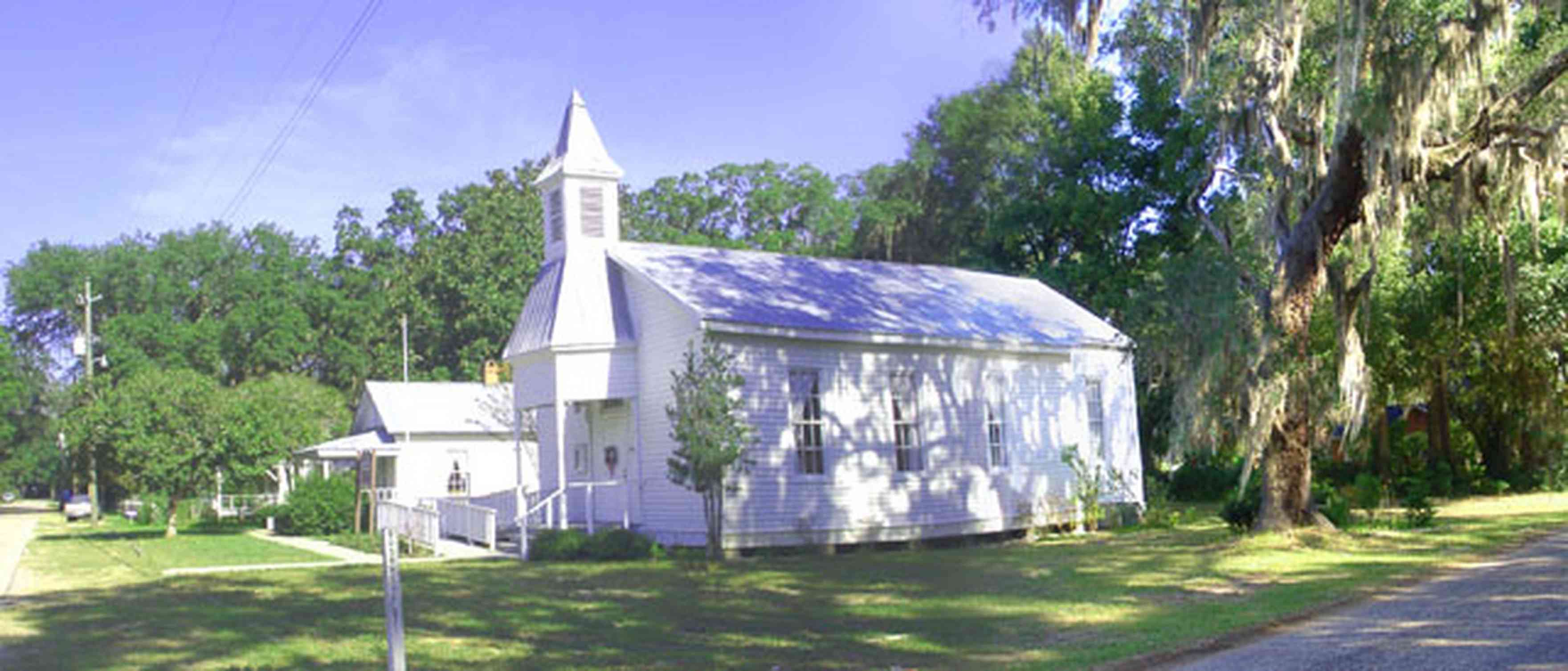 Bagdad:-Church-Museum_001.jpg:  victorian church, steeple, bell tower, spanish moss, oak trees, museum, historical society