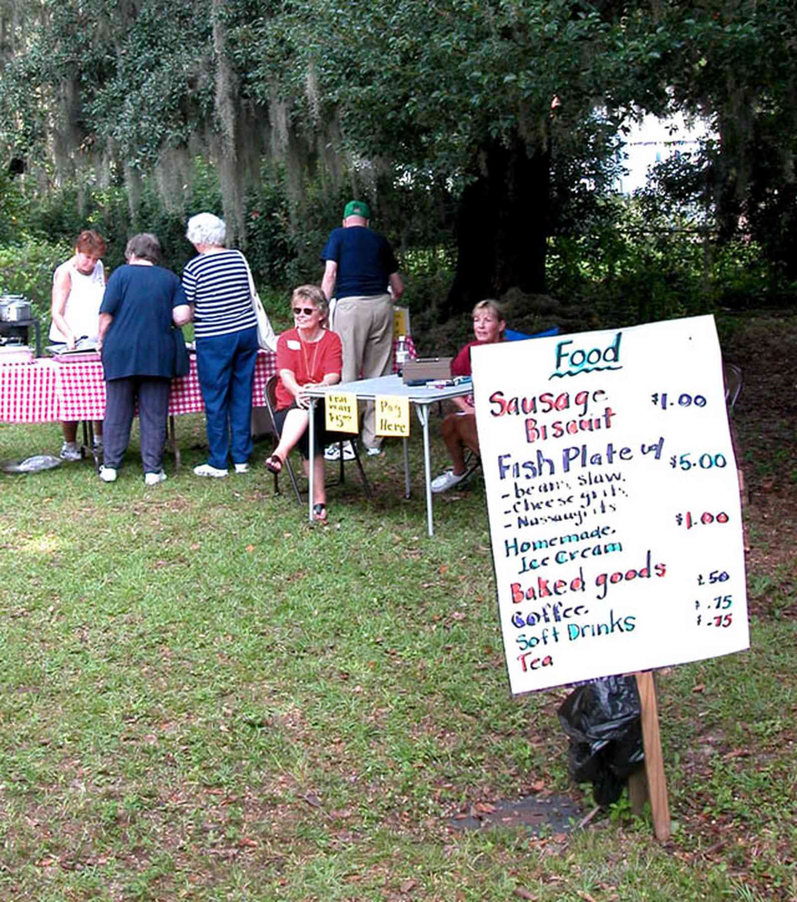 Bagdad:-Church-Museum_03.jpg:  bazaar, banquet, fish fry, neighborhood get together, picnic, red checked tablecloth, serving line, labies auxillary