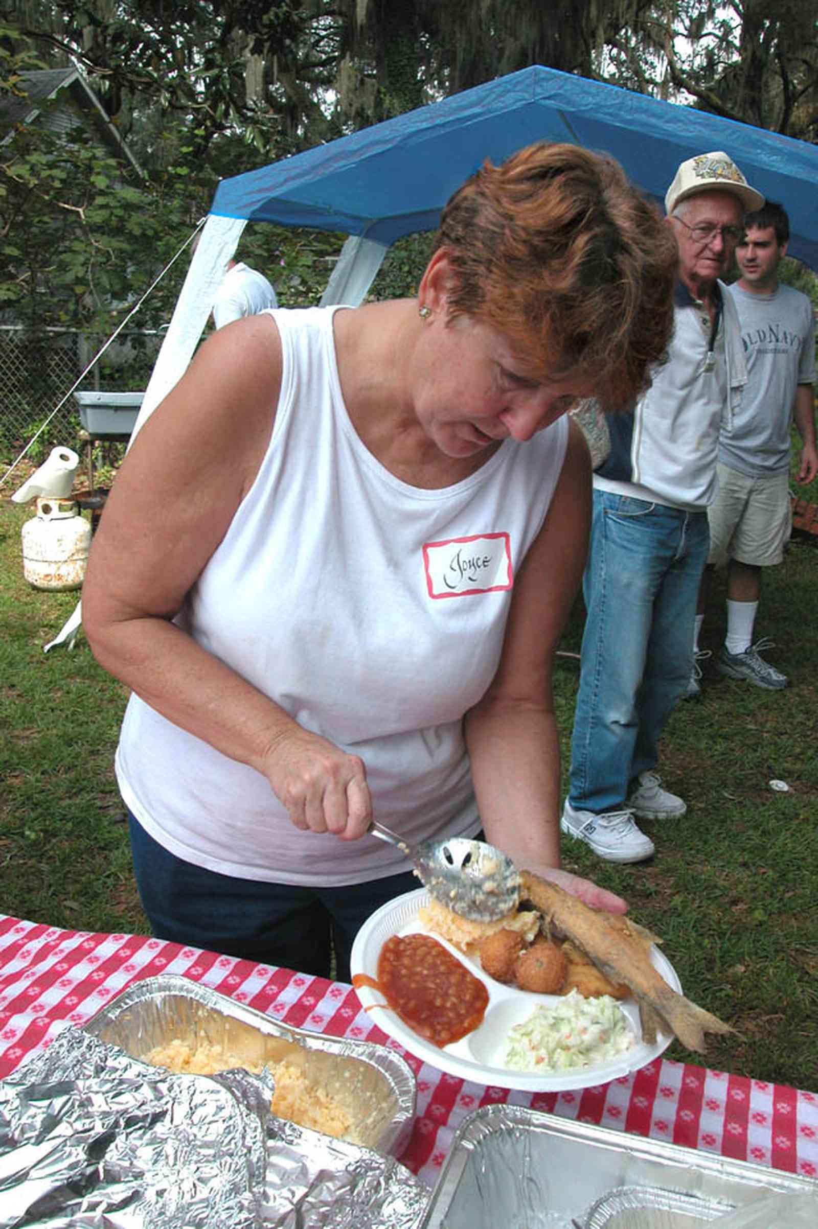 Bagdad:-Church-Museum_04.jpg:  fish fry, serving line, red checked tablecloth, hush puppies, coleslaw, ladies auxillary, market days, bake sale