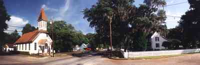 Bagdad:-Methodist-Church_00.jpg:  victorian church building, spanish moss, oak trees, small town, white picket fence , 