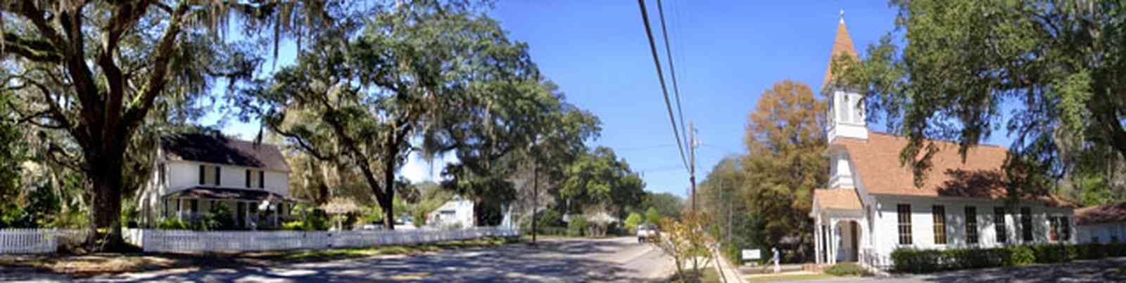 Bagdad:-Methodist-Church_01.jpg:  victorian church building, spanish moss, live oak tree, white picket fence, bagdad florida