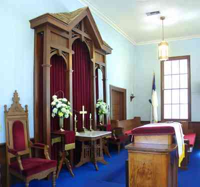 Bagdad:-Methodist-Church_06.jpg:  altar, cross, victorian church, flowers, pulpit, bible, 