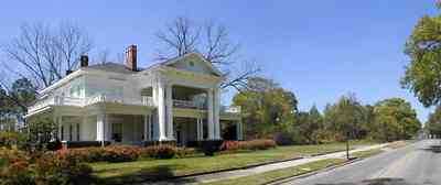 Brewton:-Belleville-Avenue_04.jpg:  victorian mansion, front porch, greek revival facade, classical revival, columns, azalea bushes, turret, colonnade