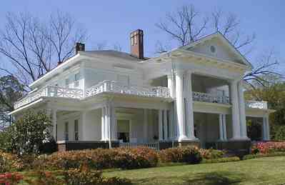 Brewton:-Belleville-Avenue_05.jpg:  victorian mansion, front porch, greek revival facade, classical revival, columns, azalea bushes, turret, colonnade