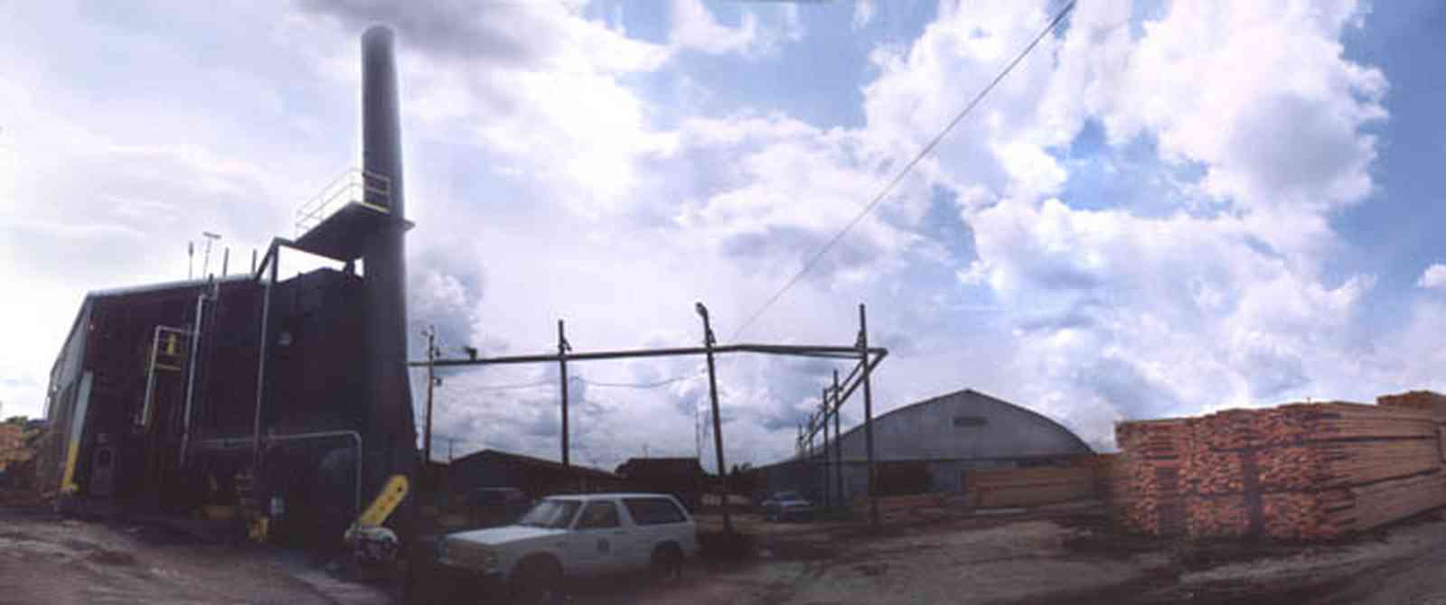 Brewton:-T.R.-Miller-Lumber-Company_7.jpg:  steam engine, stack of lumber, lumber mill