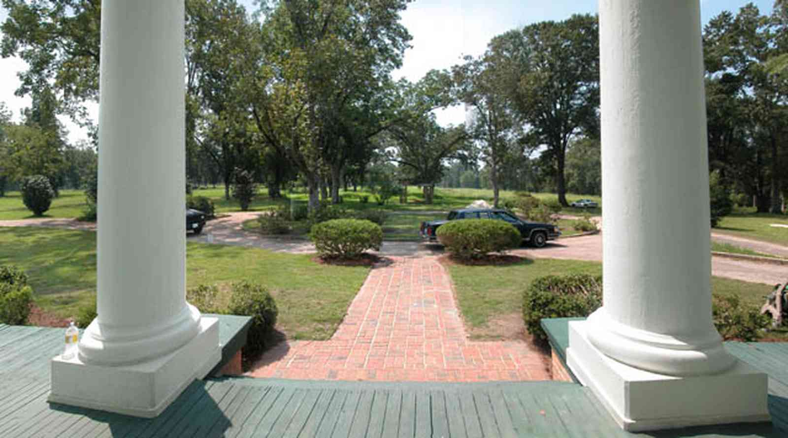 Century:-Tannenheim_01x.jpg:  pecan tree, porch, columns, azelea bush
