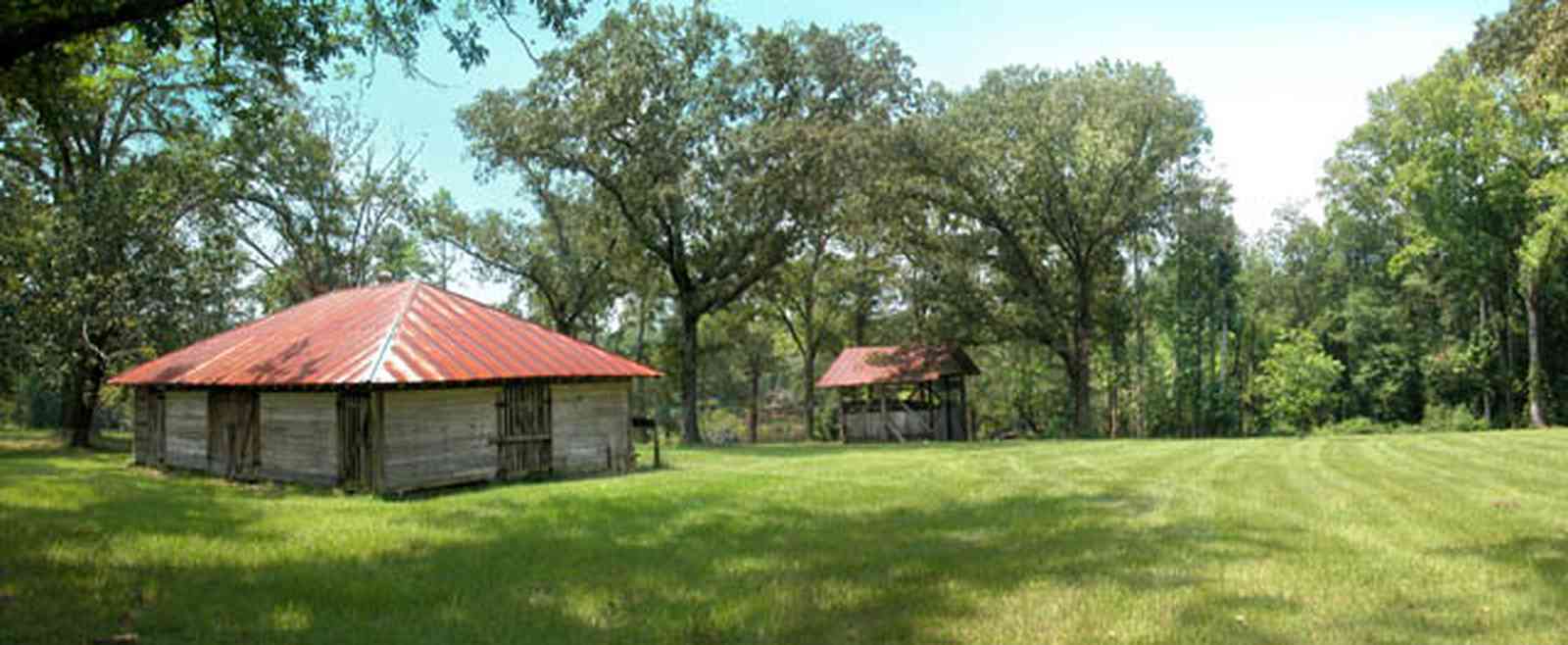 Century:-Tannenheim_21.jpg:  victorian mansion, southern mansion, white columns, heart pine wood, tongue and groove walls, pasture, lake pecan orchard, plantation, rolling pastures, stable, ice house, pump house, timber, country road