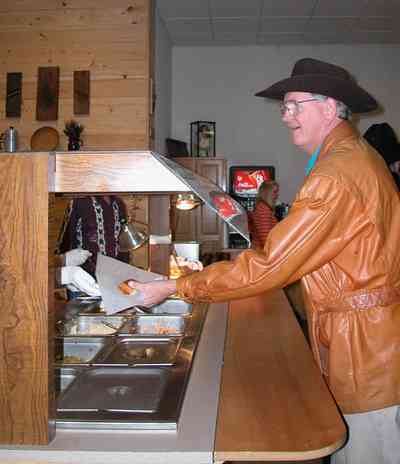 Chumuckla:-Farmers-Opry_11.jpg:  dinner, country style dining, buffet line, dance hall, music, corn bread, steam table, country music