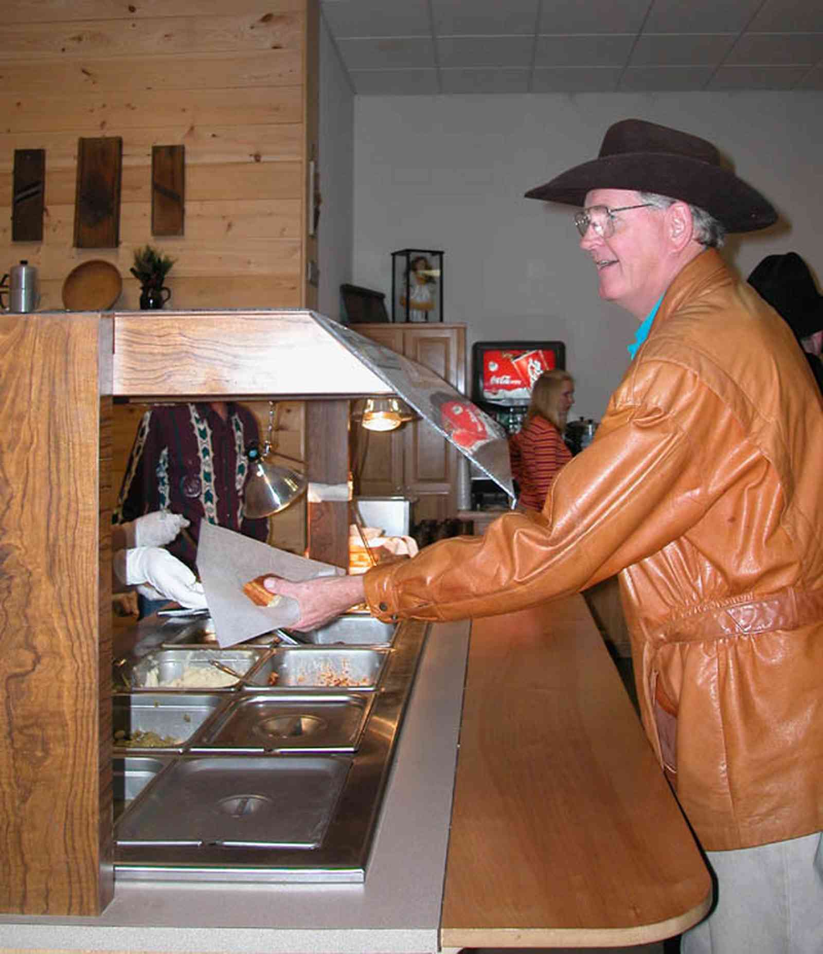 Chumuckla:-Farmers-Opry_11.jpg:  dinner, country style dining, buffet line, dance hall, music, corn bread, steam table, country music