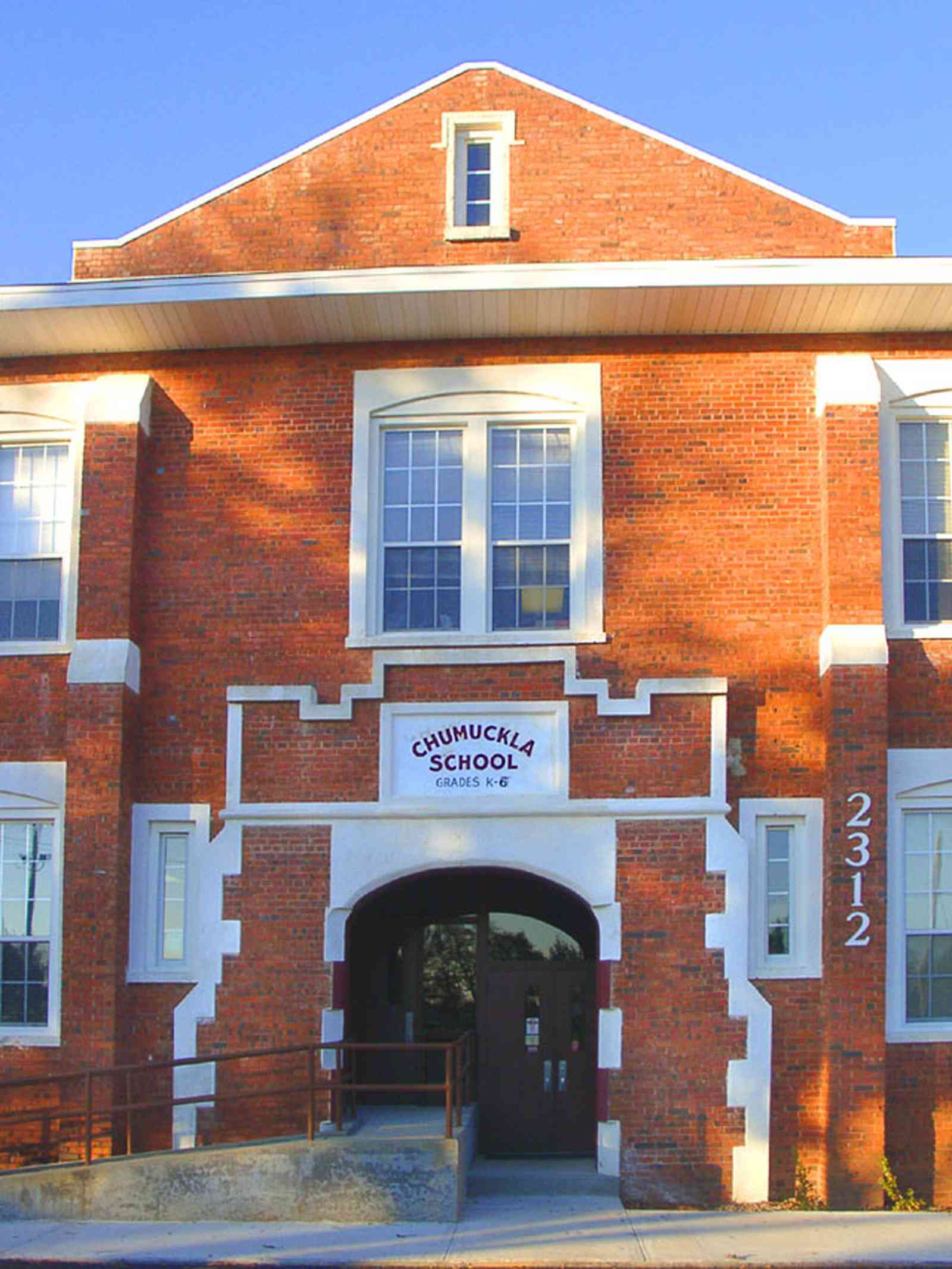 Chumuckla:-School_03.jpg:  brick facade, quoin, pediment, schoolhouse, classical revival architectural style