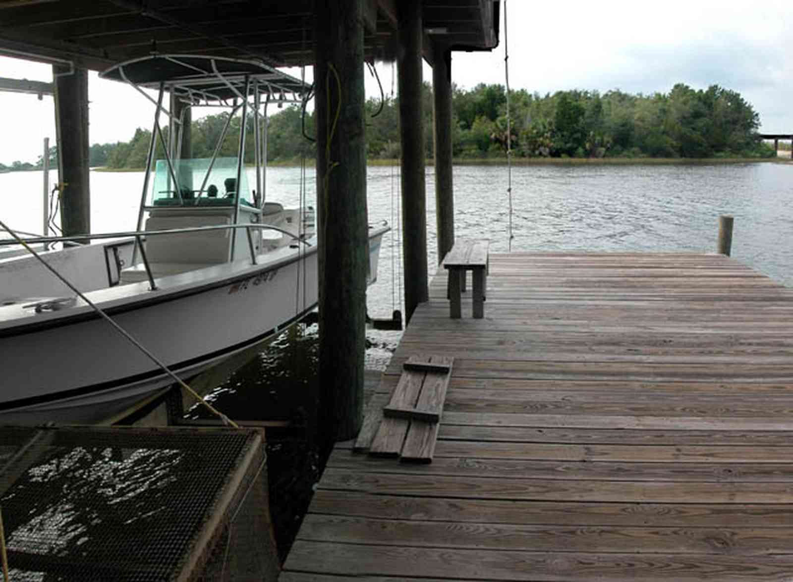 East-Hill:-1801-East-La-Rua-Street_18.jpg:  boat, pier, deck, boardwalk, island, pensacola bay, bench, crab trap, railroad trestle