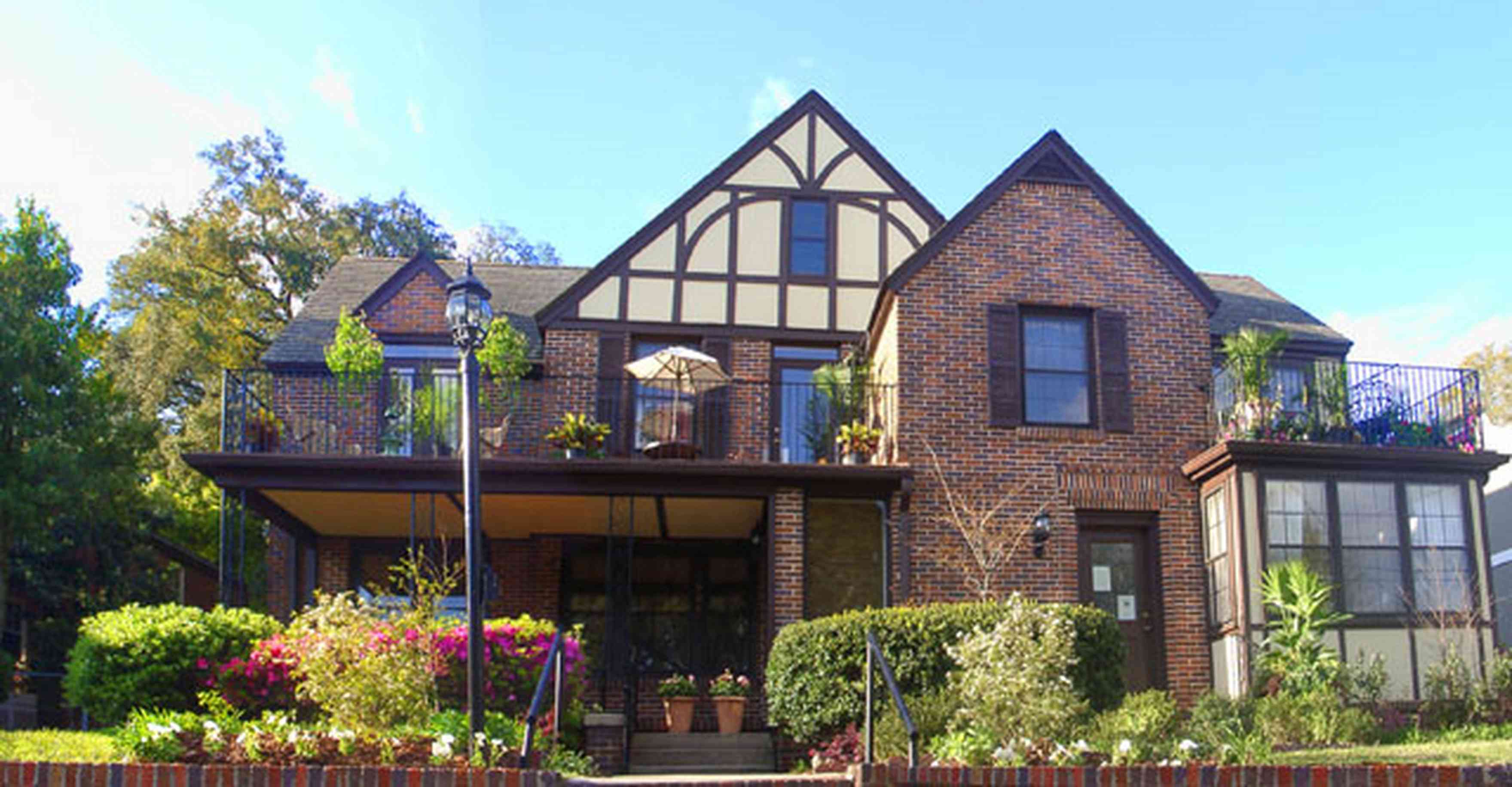 East-Hill:-1804-East-La-Rua-Street_02.jpg:  english tudor architecture, azaela bushes,bay