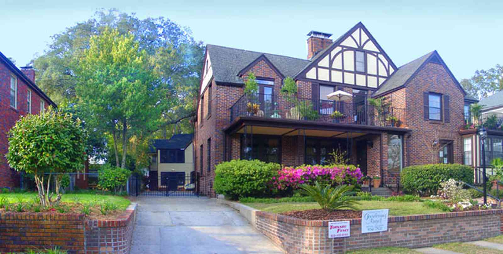 East-Hill:-1804-East-La-Rua-Street_03.jpg:  english tudor architecture, balcony, bay, carriage house, azalea bush