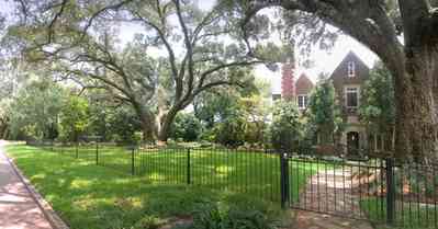 East-Hill:-1919-East-La-Rua-Street_00.jpg:  oak trees, red brick house, english tudor architecture, bluffs