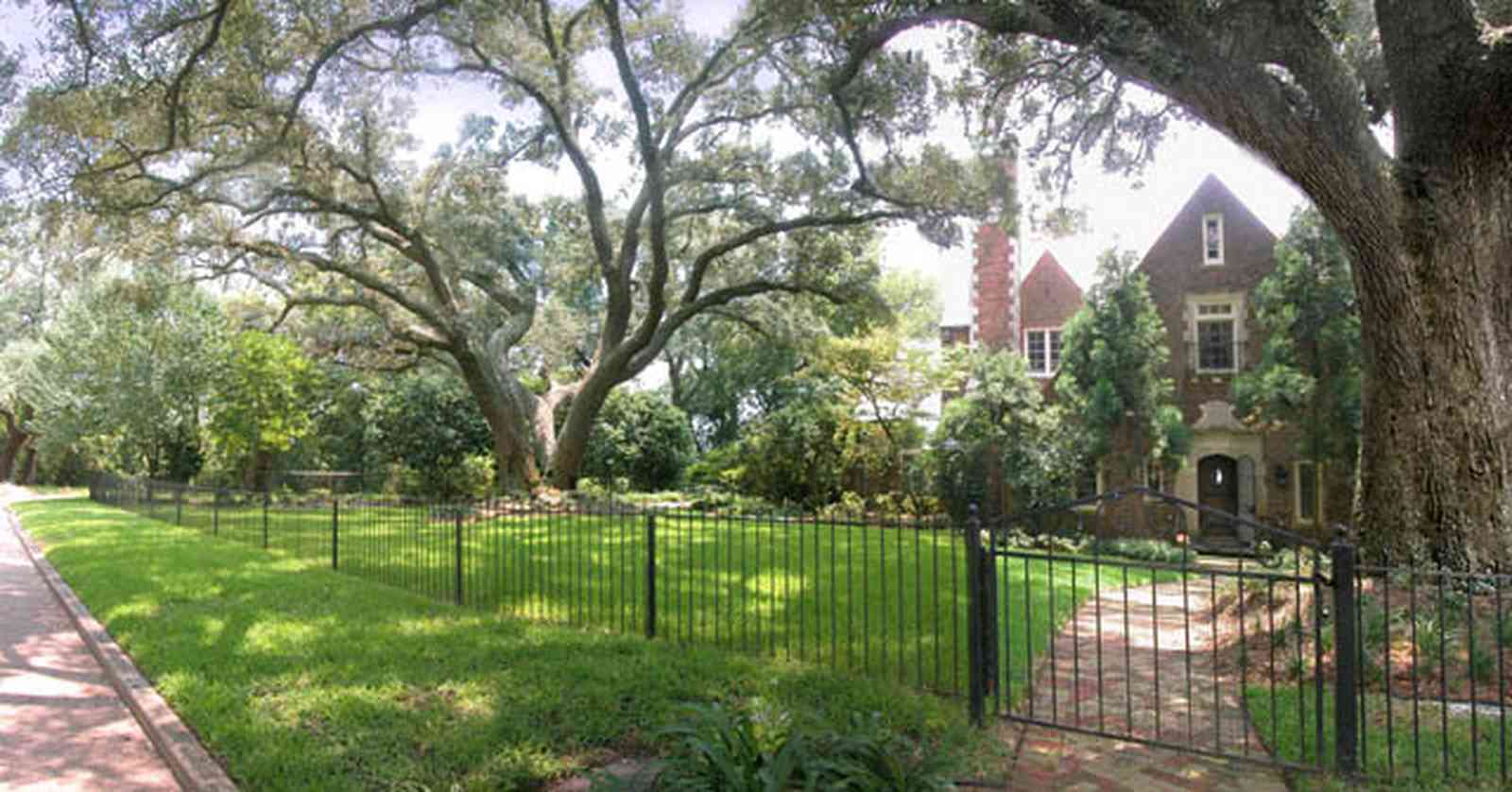 East-Hill:-1919-East-La-Rua-Street_00.jpg:  oak trees, red brick house, english tudor architecture, bluffs