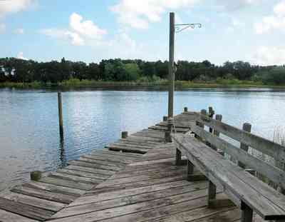 East-Hill:-1919-East-La-Rua-Street_08.jpg:  deck, bench, bayou, swamp, sawgrass, bayou texar, cumulus clouds, fishing pier, 