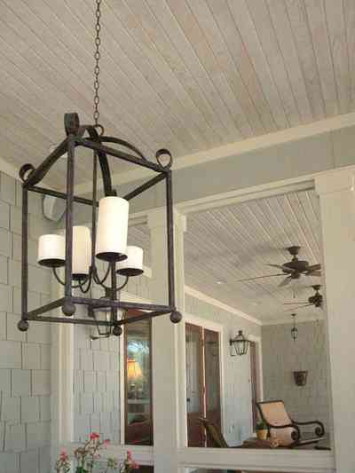 East-Hill:-2109-Whaley-Drive_17.jpg:  wrought-iron lantern, ceiling fan, wooden shingles, ranch-style home