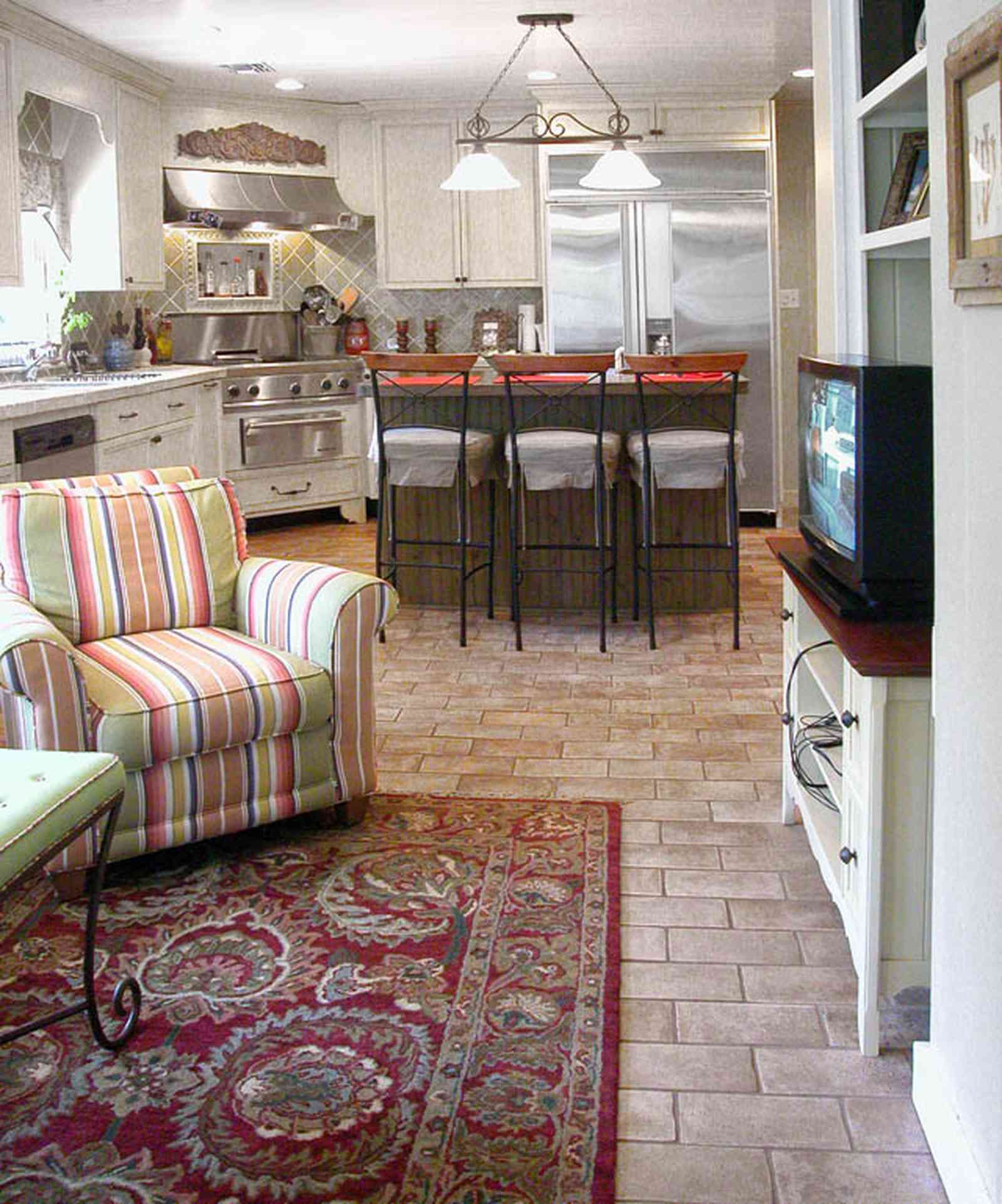 East-Hill:-2109-Whaley-Drive_24.jpg:  kitchen, oriental rug, cabinets, stainless appliances, kitchen island