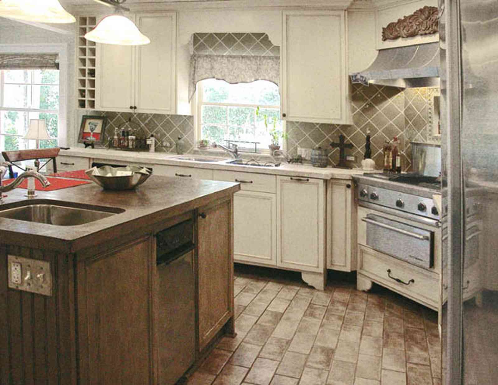 East-Hill:-2109-Whaley-Drive_26.jpg:  kitchen island, stainless appliances, ceramic tile, porcelin tile, wine rack