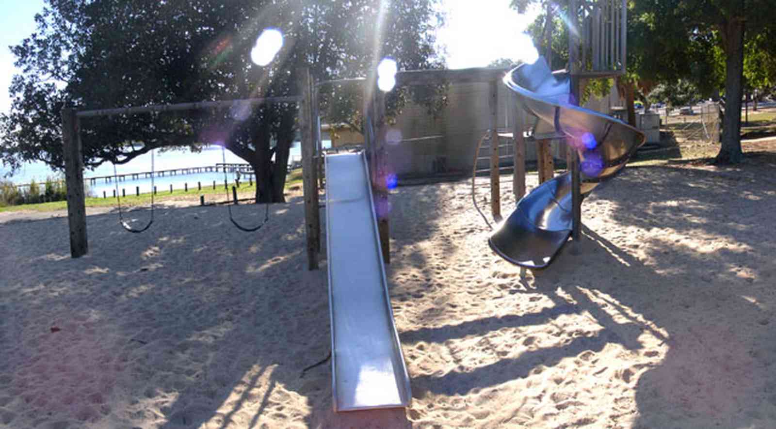 East-Hill:-Bayview-Park_10.jpg:  slide, tree house, magnolia tree, oak tree, bayou texar, escambia county, sand box, corkscrew slide, swing
