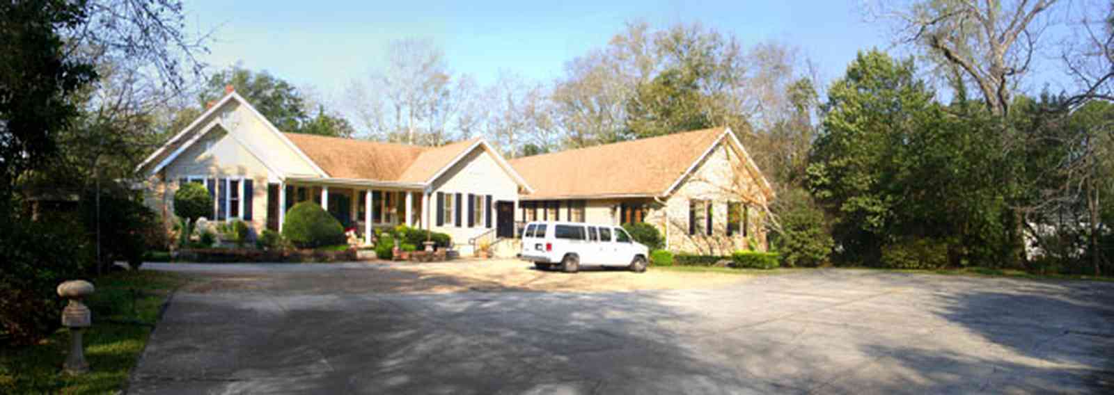 East-Hill:-McAlpin-Shop_04.jpg:  clapboard siding, gable roof, colonial style home, shutters, 