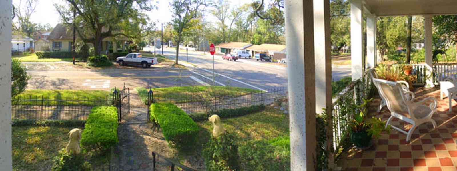 East-Hill:-McAlpin-Shop_09.jpg:  oak trees, front porch, traditional style, brick sidewalk, box hedge, wrought iron fence, 