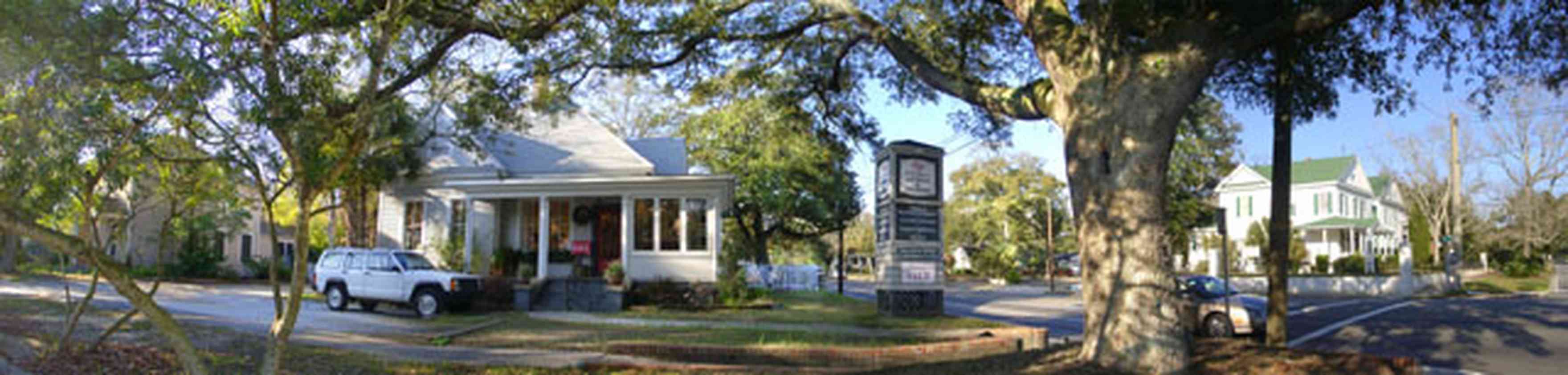 East-Hill:-Mills-Antiques_02.jpg:  donut shop, 1960's architectural style, striped awning, neon sign