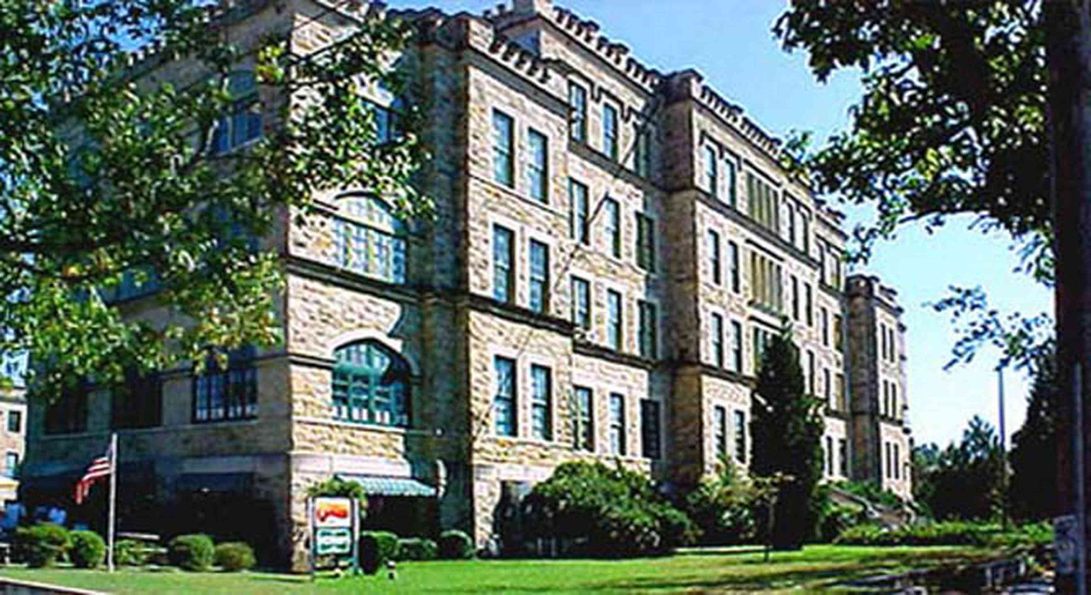 East-Hill:-Tower-East:-Old-Sacred-Heart-Hospital_01a.jpg:  gothic revival architecture, castle, battlements, stone building, oak tree, moorish arch, fir tree