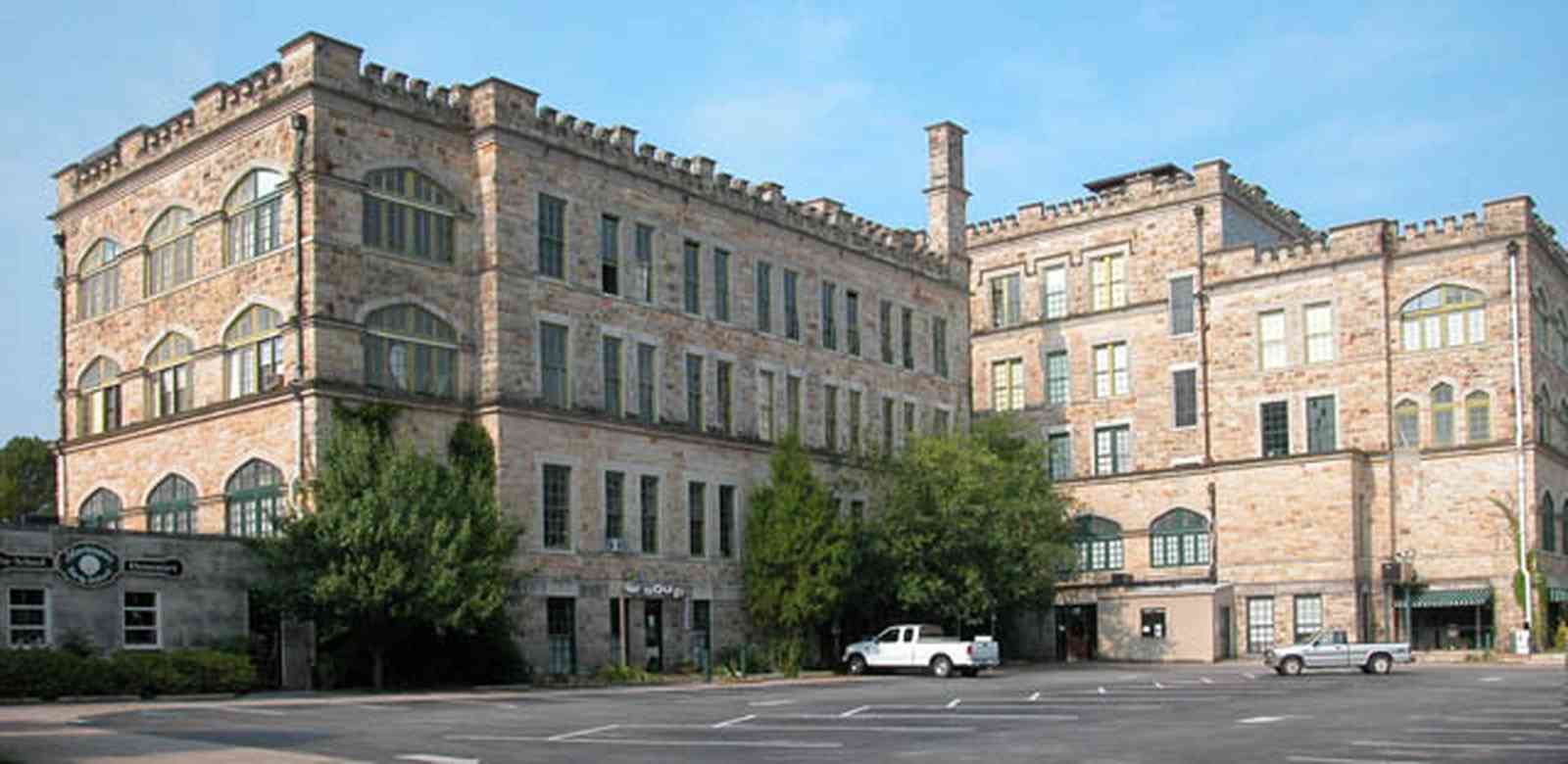 East-Hill:-Tower-East:-Old-Sacred-Heart-Hospital_30.jpg:  fir tree, stone battlements, entrance patio, hospital