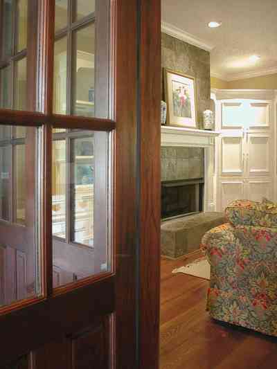 East-Pensacola-Heights:-112-Chipley-Avenue_08.jpg:  heart-pine floor, marble mantle, cupboard, french doors, screen porch