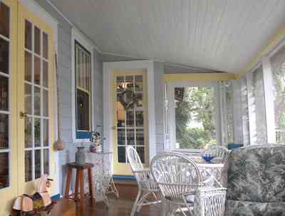 East-Pensacola-Heights:-600-Bayou-Blvd_24.jpg East-Pensacola-Heights:-600-Bayou-Blvd_24.jpg: screened porch, wicker furniture, wooden floors, french doors