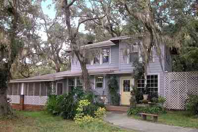 East-Pensacola-Heights:-600-Bayou-Blvd_26.jpg East-Pensacola-Heights:-600-Bayou-Blvd_26.jpg: wood frame construction, mossy oaks, spanish moss, side door, screen porch, brick pillars, bayou view, camellia bush,