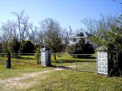Elberta:-Farm_00a.jpg:  pecan orchard, gate, fence, pillars, alabama, highway 98, 