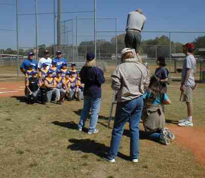 Ensley:-JR-Jones-Ballfield_09.jpg:  photographer, dugout, ball players, mike, little league players