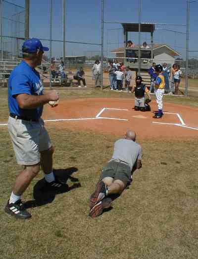 Ensley:-JR-Jones-Ballfield_09c.jpg:  photographer, dugout, ball players, mike, little league players