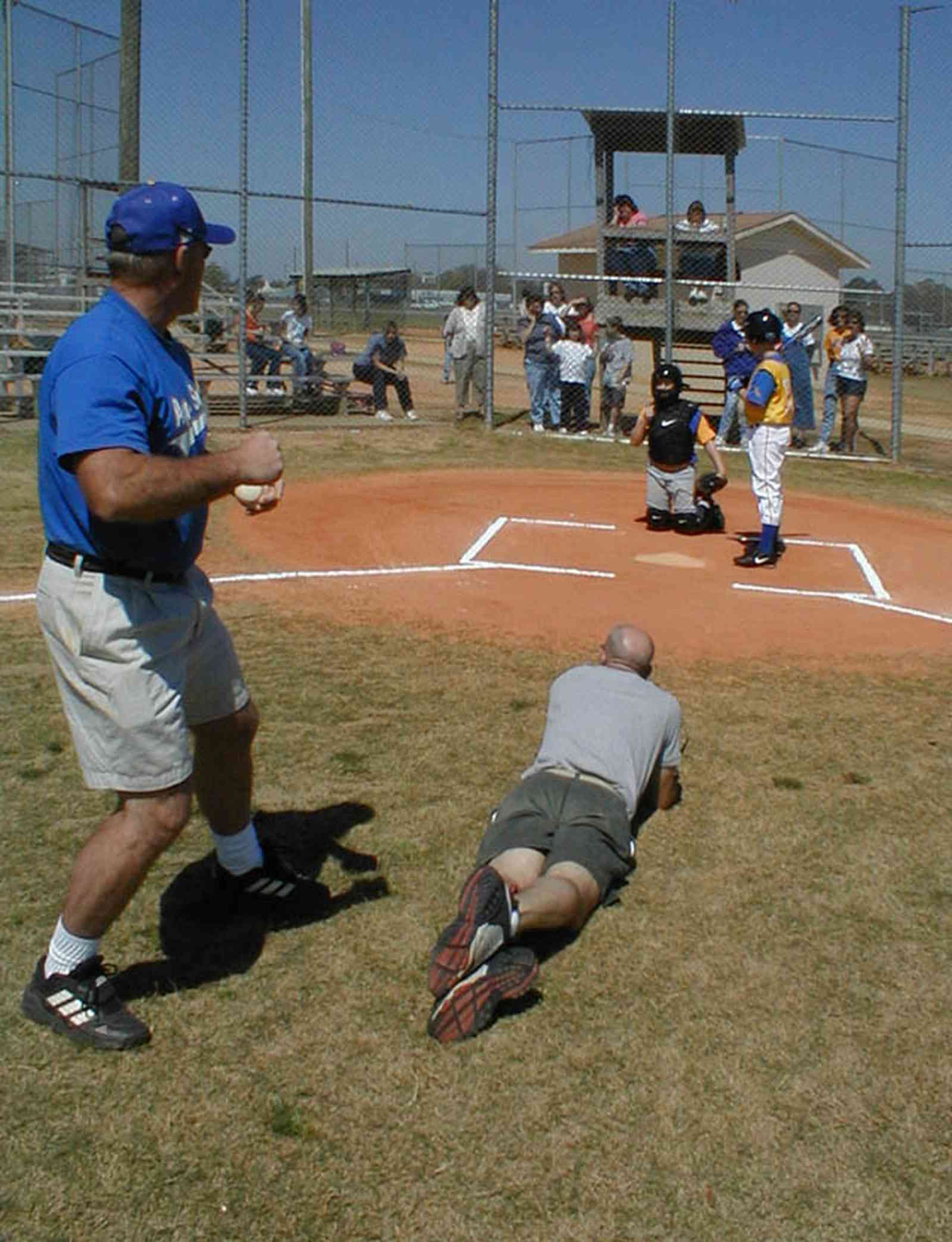 Ensley:-JR-Jones-Ballfield_09c.jpg:  photographer, dugout, ball players, mike, little league players