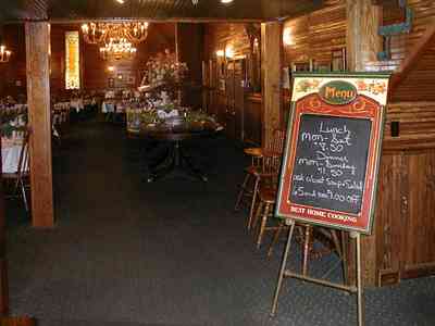 Foley:-The-Gift-Horse-Restaurant_01.jpg:  brass chandelier, beaded pine walls, buffet table, banquet table, silver compote, restaurant