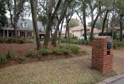 Gulf-Breeze:-228-North-Cliff-Dr_01.jpg:  mailbox, oak trees, driveway, subdivision, waterfront lot