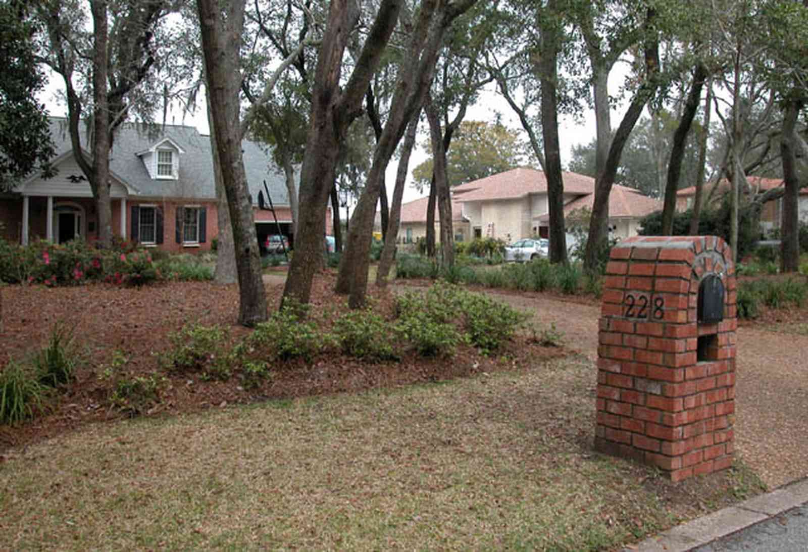 Gulf-Breeze:-228-North-Cliff-Dr_01.jpg:  mailbox, oak trees, driveway, subdivision, waterfront lot