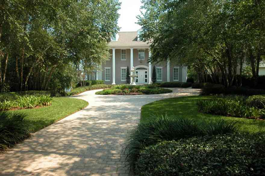 Gulf-Breeze:-72-Highpointe-Drive_01.jpg:  gas lantern, birch trees, circular driveway, fountain, tiled driveway