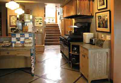 Gulf-Breeze:-92-High-Point-Drive_06.jpg:  kitchen range, restaurant gas range, side board, stairs, copper range hood, tile floor