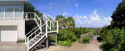 Gulf-Breeze:-Navy-Cove-House_05.jpg:  gulf coast, stairs, boat dock, palm, gulf of mexico, gulf breeze, boat launch trees, bay, channel, river, island garage, house
