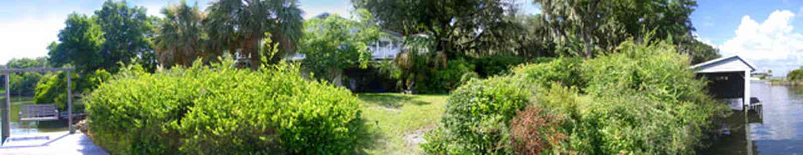 Gulf-Breeze:-Navy-Cove-House_07.jpg:  escambia bay, gulf coast, channel, river, house, palm tree, swing, island, dead man's island, gulf breeze