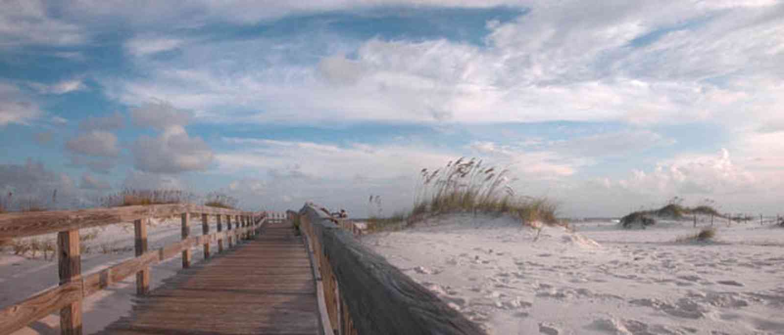 Gulf-Islands-National-Seashore:-Opal-Beach_05.jpg:  boardwalk, dunes, sea oats, crystal white sand, railing, mixed skies, gulf of mexico