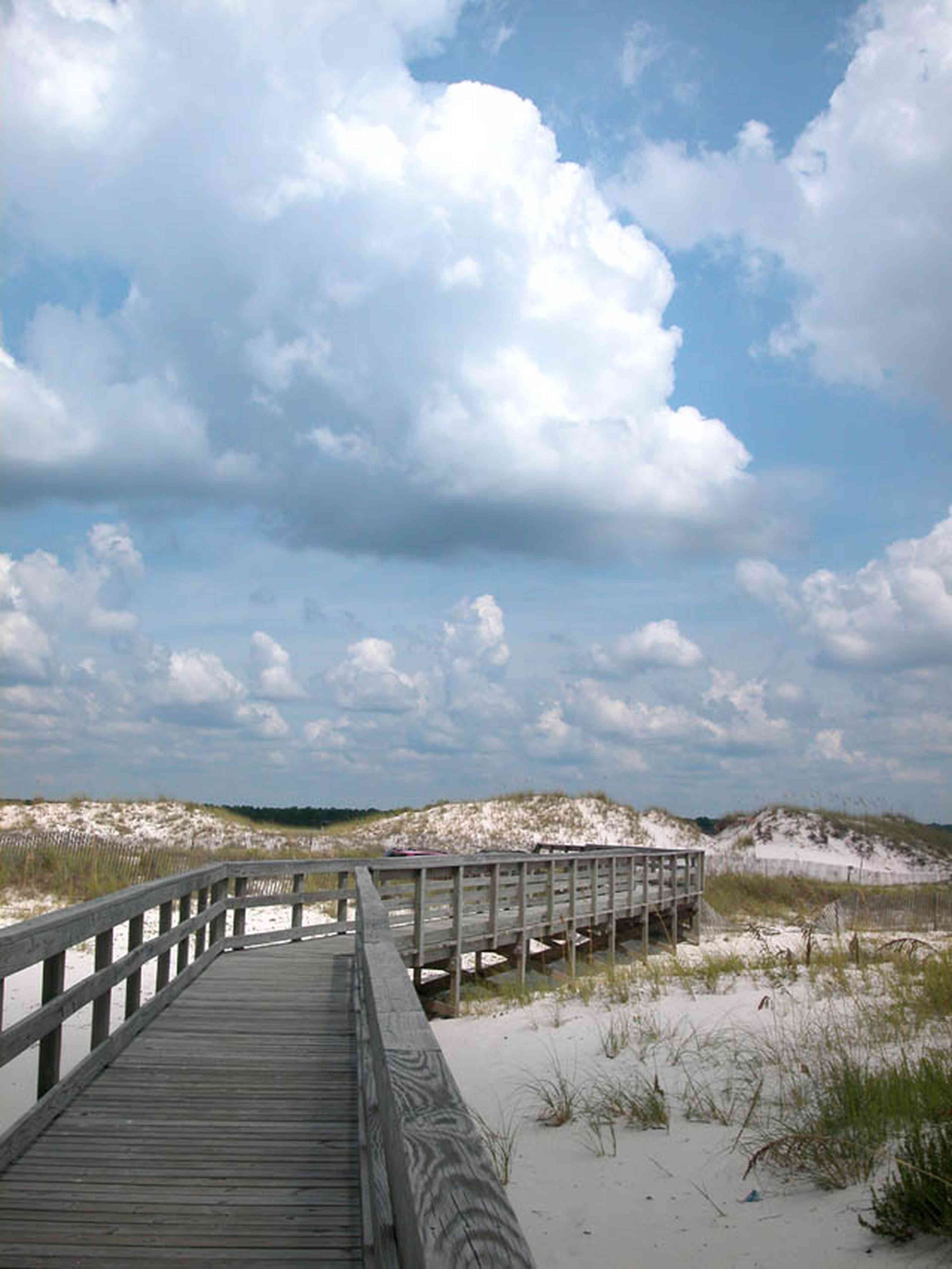 Gulf-Islands-National-Seashore:-Perdido-Key:-Boardwalk-E_01.jpg:  sand dunes, boardwalk, cumulus clouds, barrier island,  sea oats, nature trail