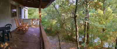 Milton:-Adventures-Unlimited_15.jpg:  rocking chair, wolfe creek, swamp, cabin, camping